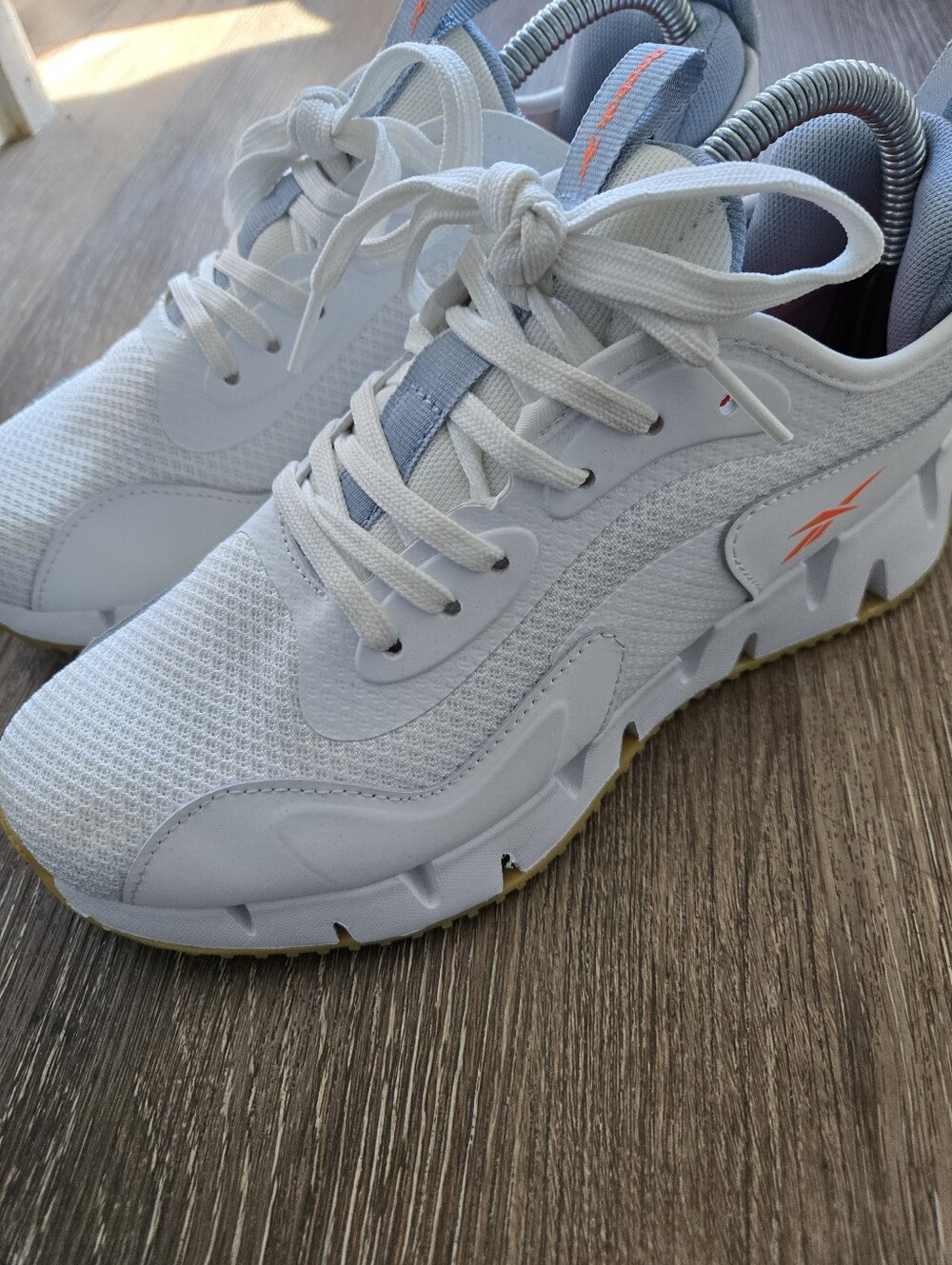 Reebok Women's White Athletic Sneakers with Orange Accent